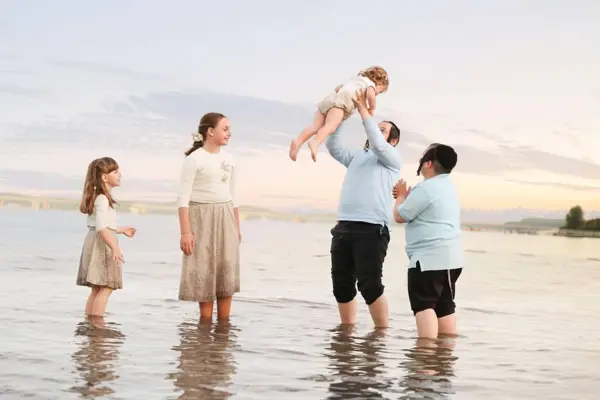 Family playing in the water at sunset, outdoor photography by Photoholic, Rockland County NY
