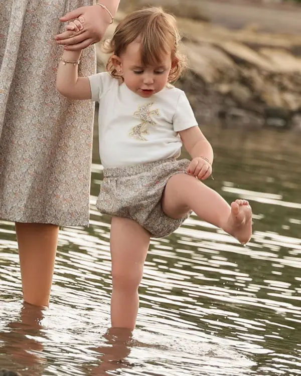 Toddler splashing in a stream with her sister, outdoor photography by Photoholic, Rockland County NY
